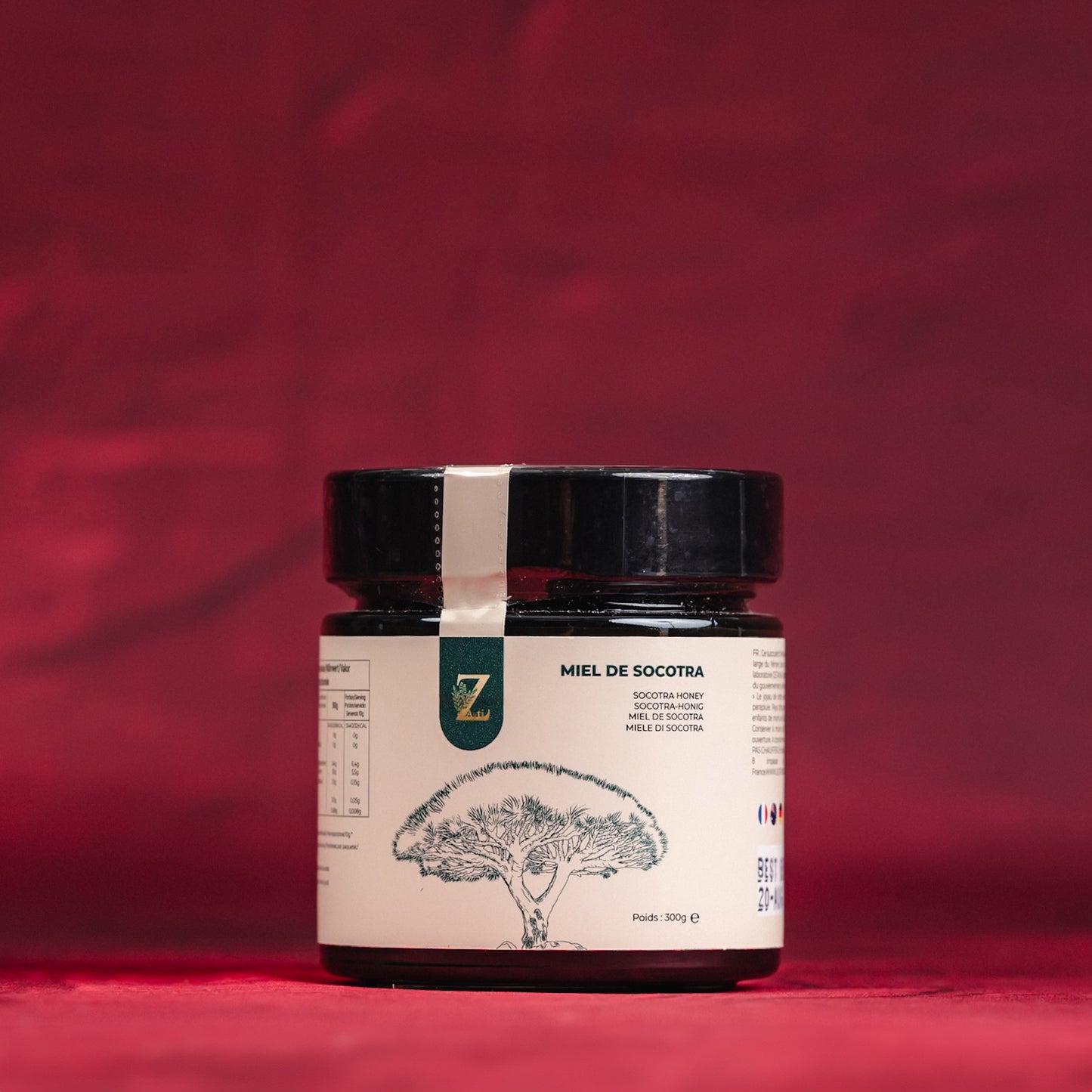Jar of rare Socotra honey with a label on a red background