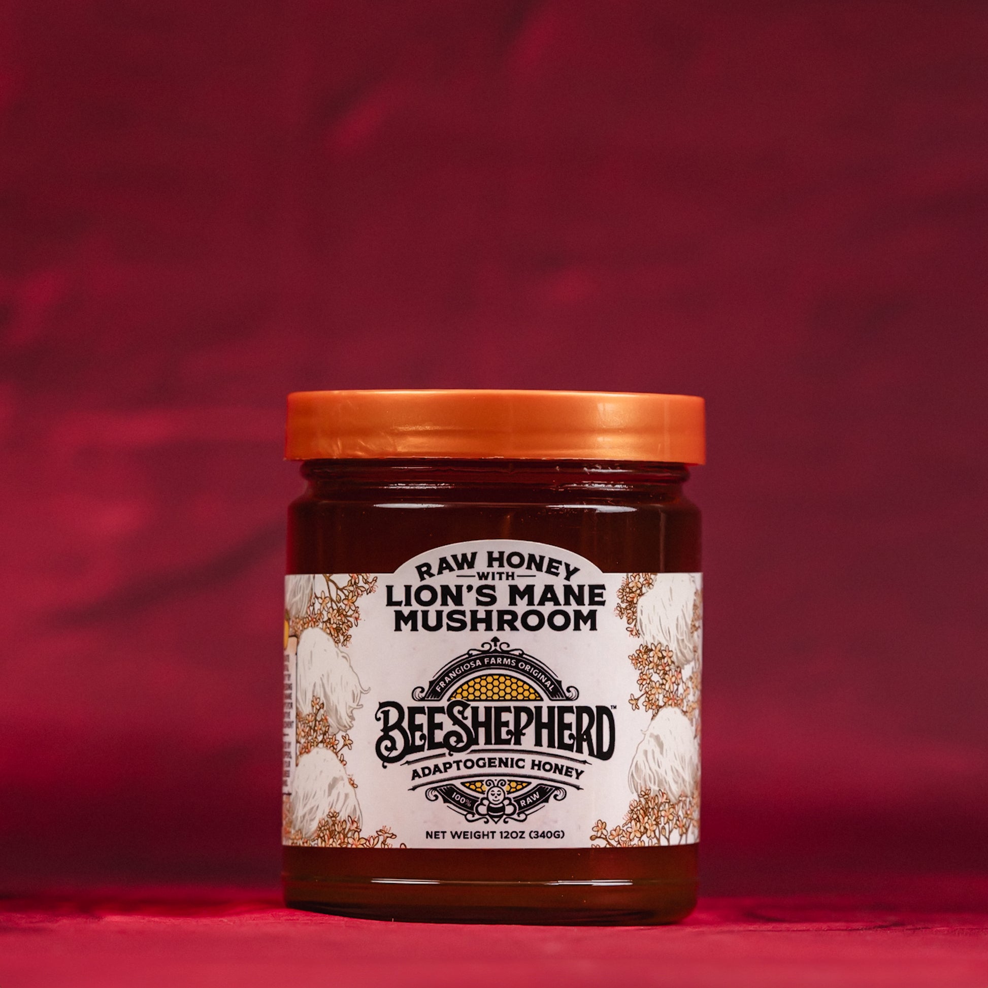 Jar of Beeshepherd Lion's Mane Mushroom honey on a red background